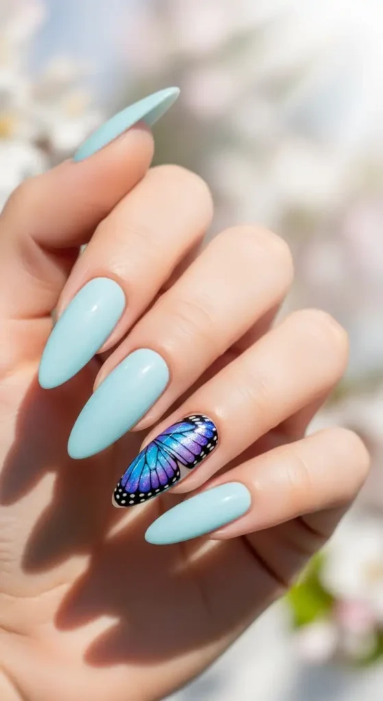 light-blue-nails-with-butterfly-wing-tips